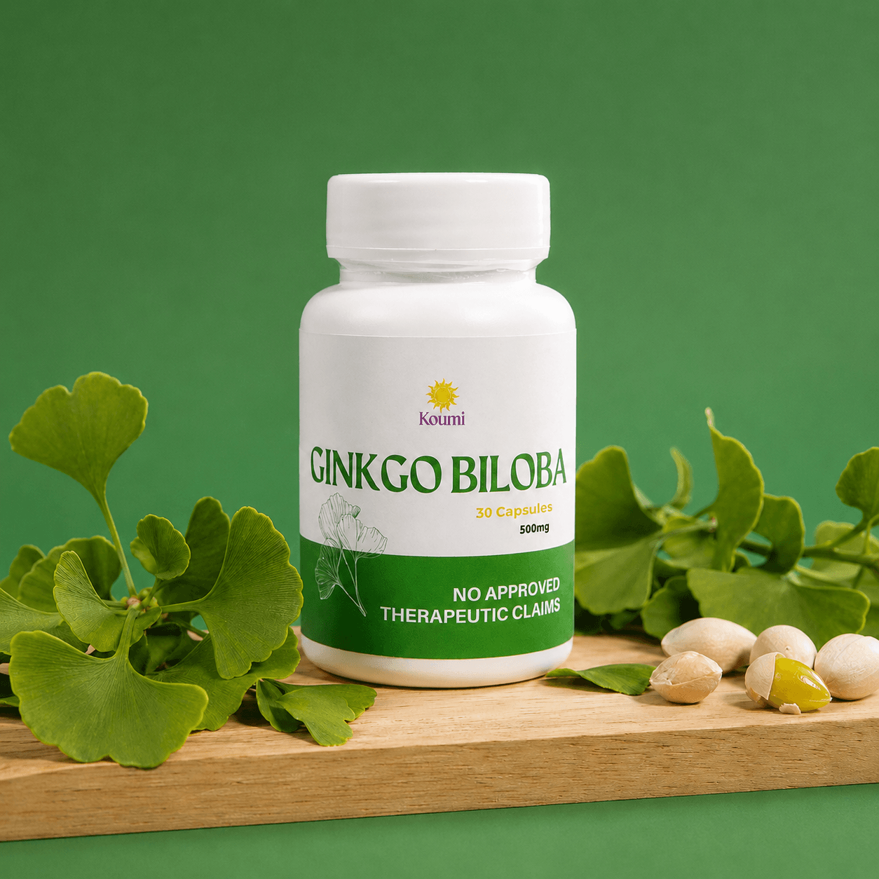 Koumi Ginkgo Biloba bottle resting on a wooden plank surrounded by ginkgo leaves and capsules